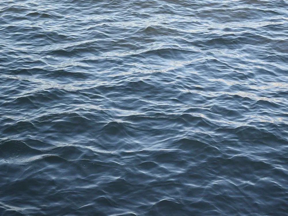 a close up of a body of water with waves