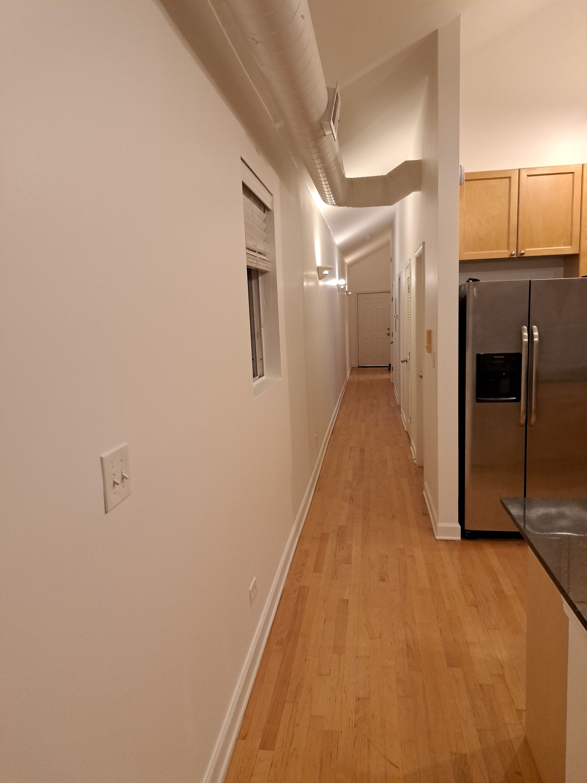 a kitchen under construction with a large island in the middle .