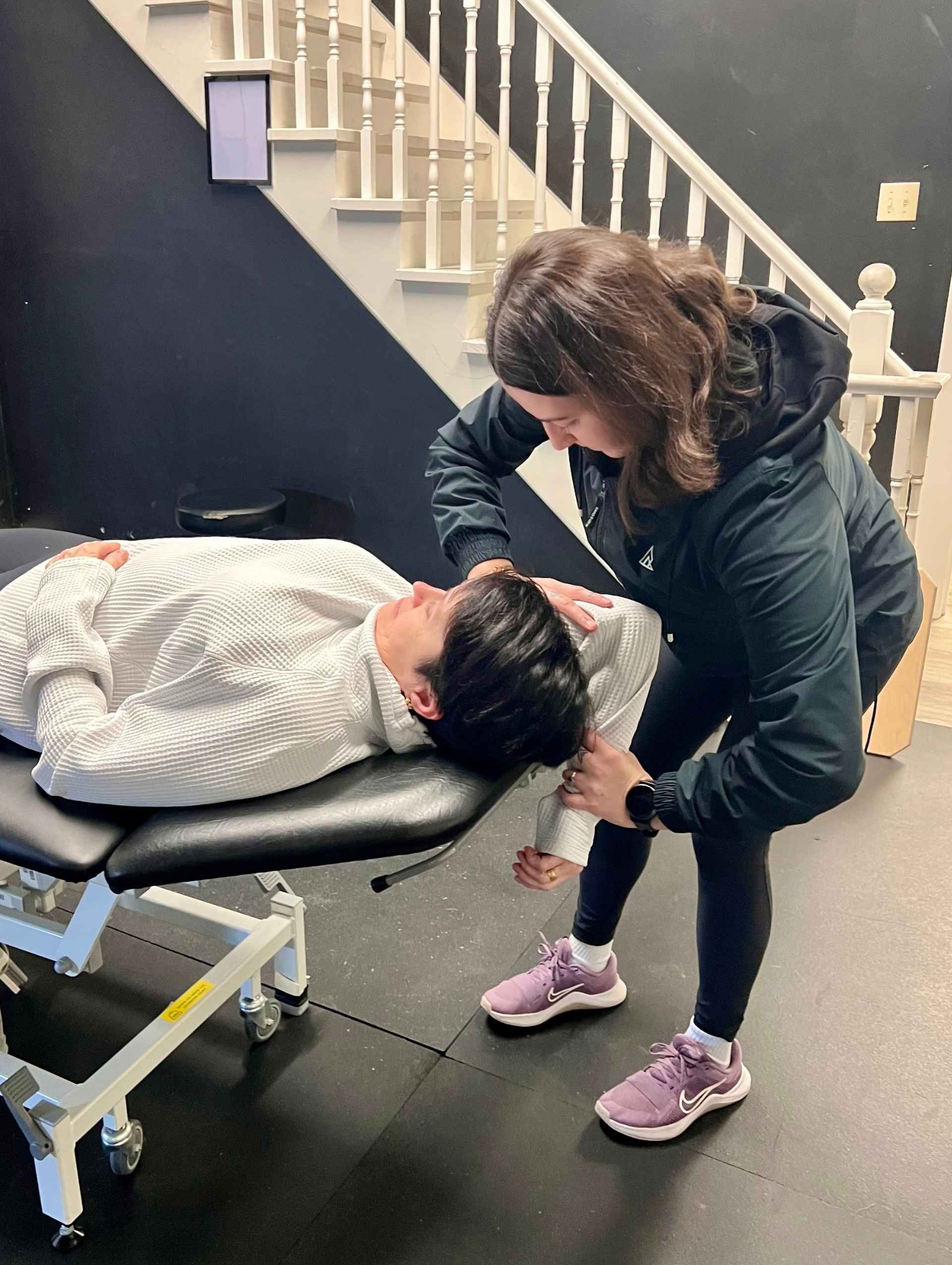 One-on-one assisted stretch therapy session for shoulder mobility at Propel Active Burlington healthcare clinic
