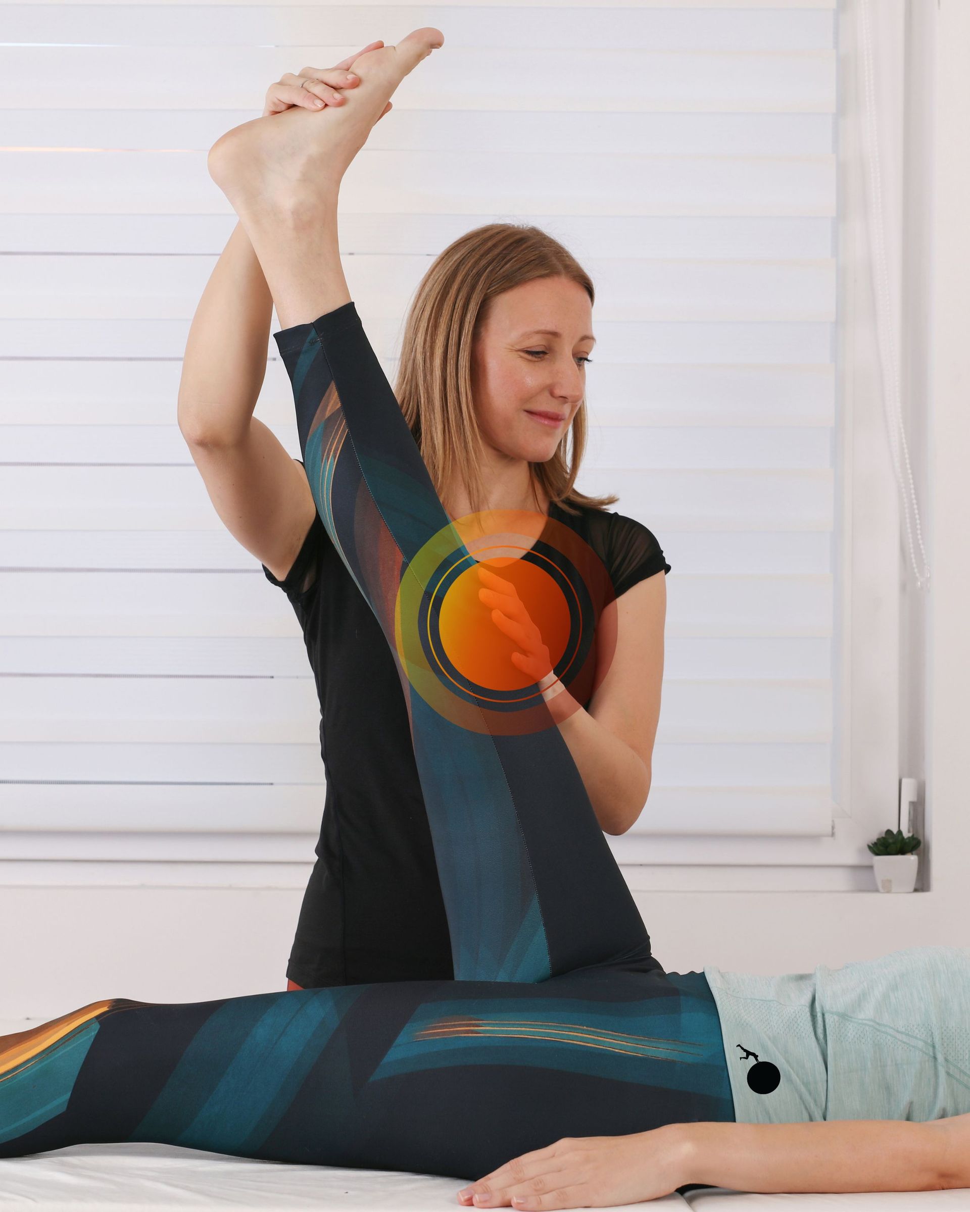 Athletic therapist guiding a patient through a mobility exercise