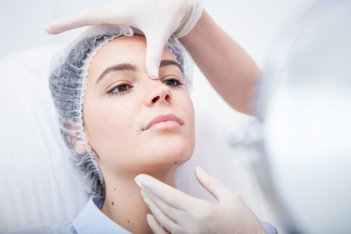 Woman checking by her dermatology – Cincinnati, OH - Dr. Bruce Younger, MD