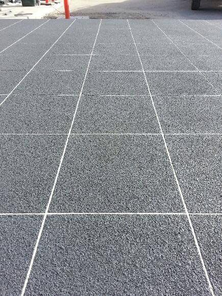 A Close Up Of A Tiled Floor With White Lines — Custom Concrete Finishes In Albury, NSW