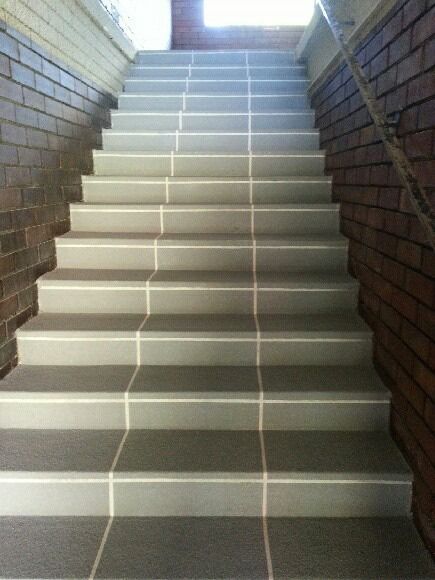 A Set Of Stairs Leading Up To A Brick Wall — Custom Concrete Finishes In Thurgoona, NSW