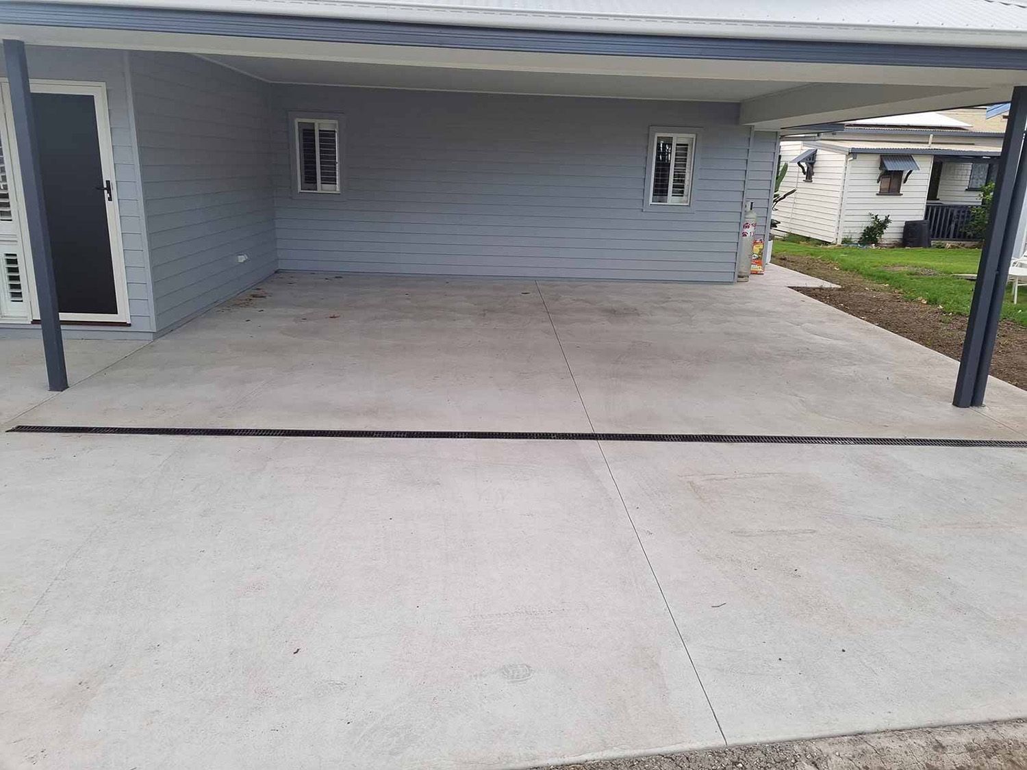 Concrete Carport With A Gray Exterior