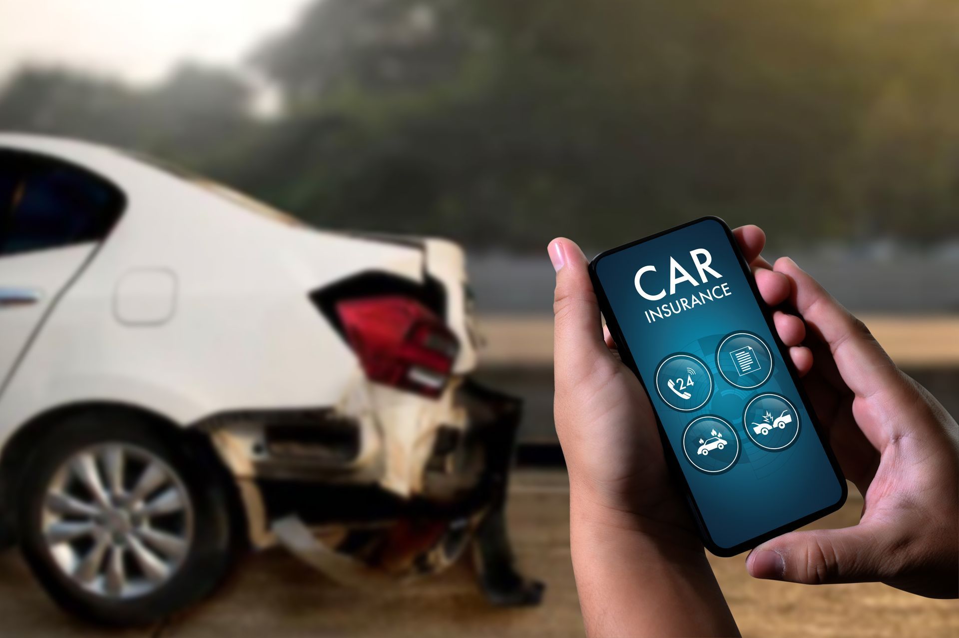A driver looking over his auto insurance policy after experiencing a car crash.