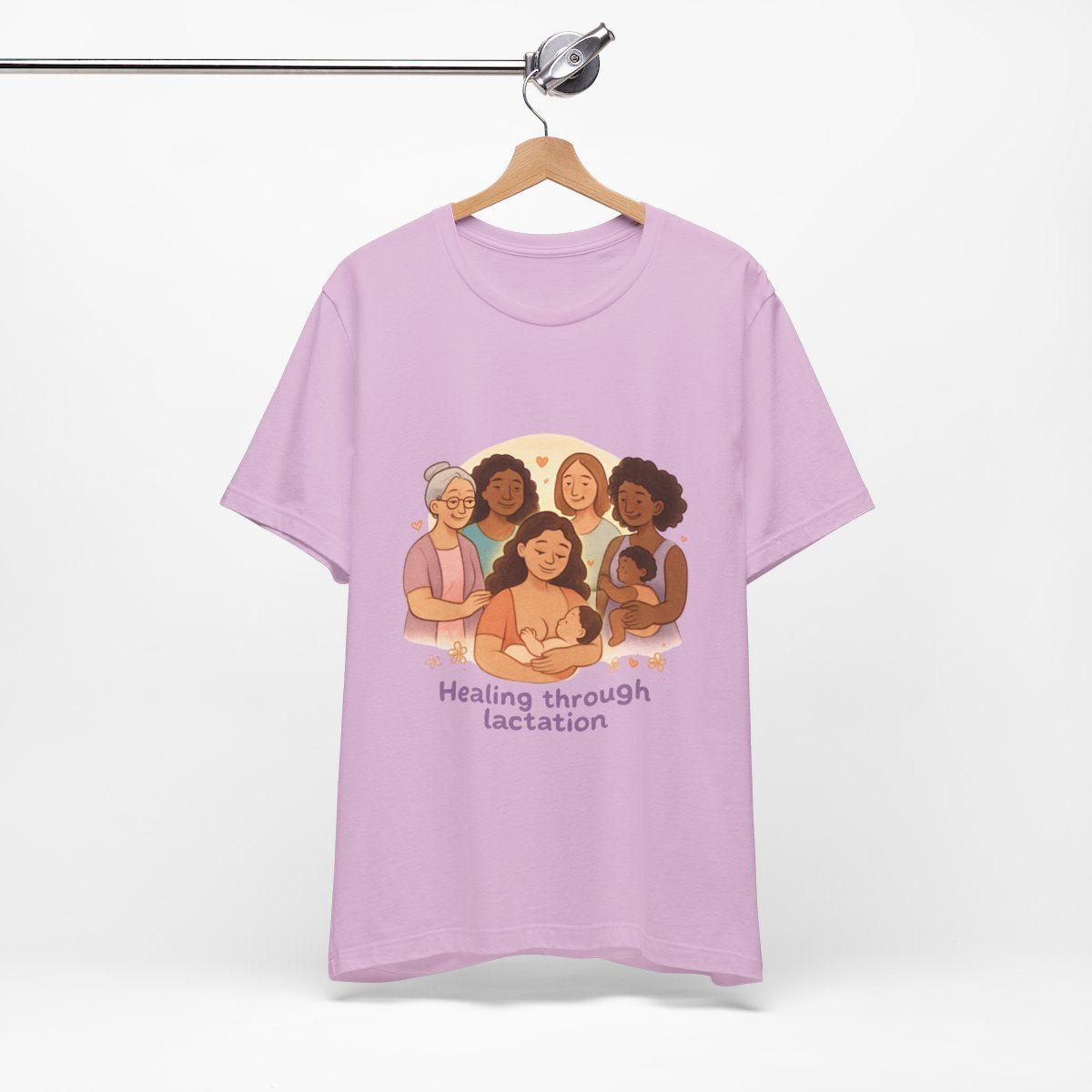 Pink T-shirt with an illustration of six people and the text “Healing through Lactation”