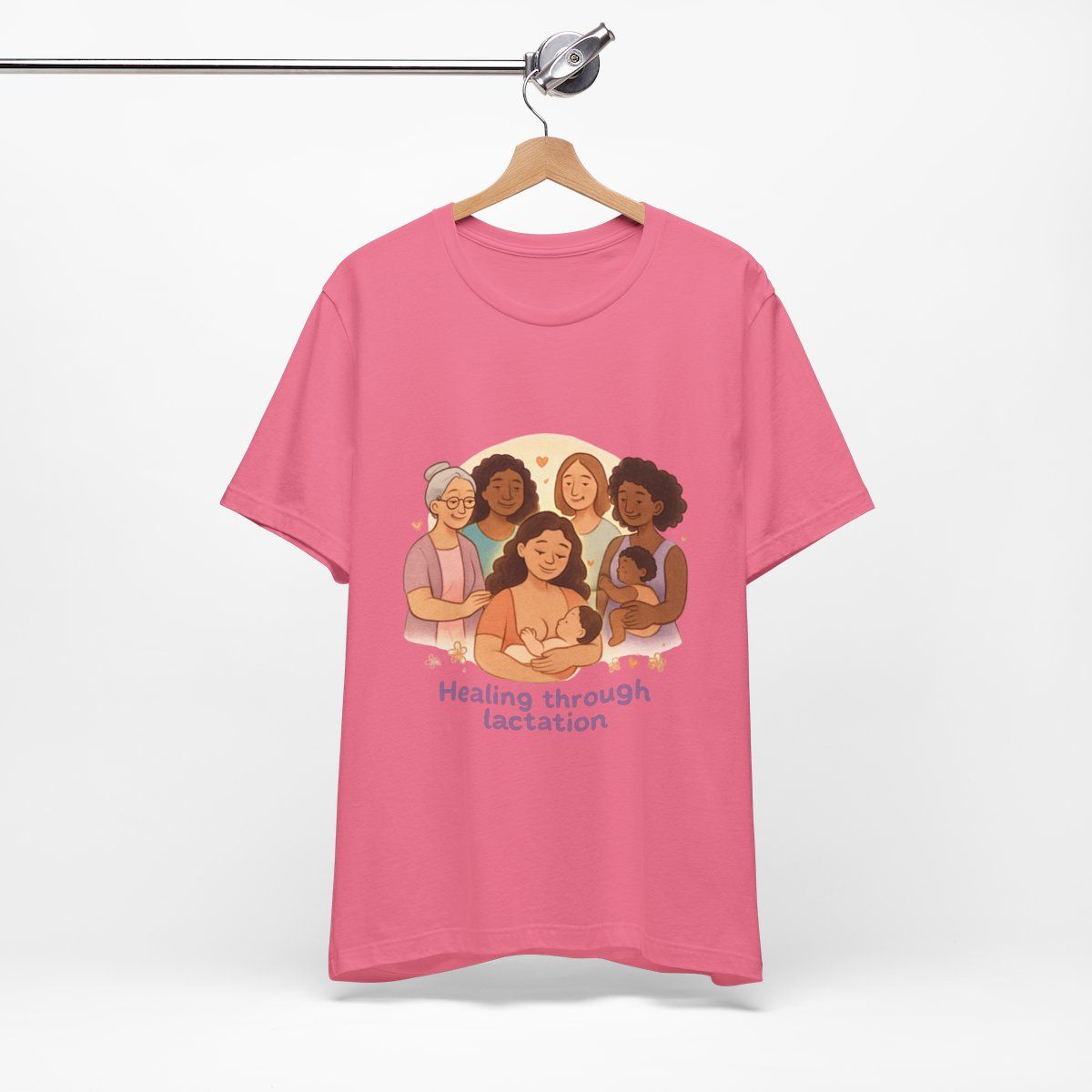 Pink T-shirt with an illustration of five people and the text “Healing through Location.”