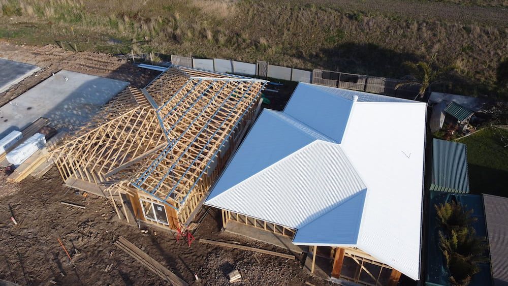An Aerial View of a House Under Construction With a White Roof — iFix Roofing Bendigo in Bendigo, VIC