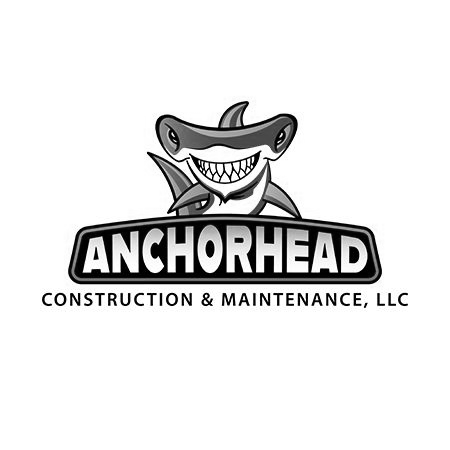 Shark mascot with a large grin above the words 