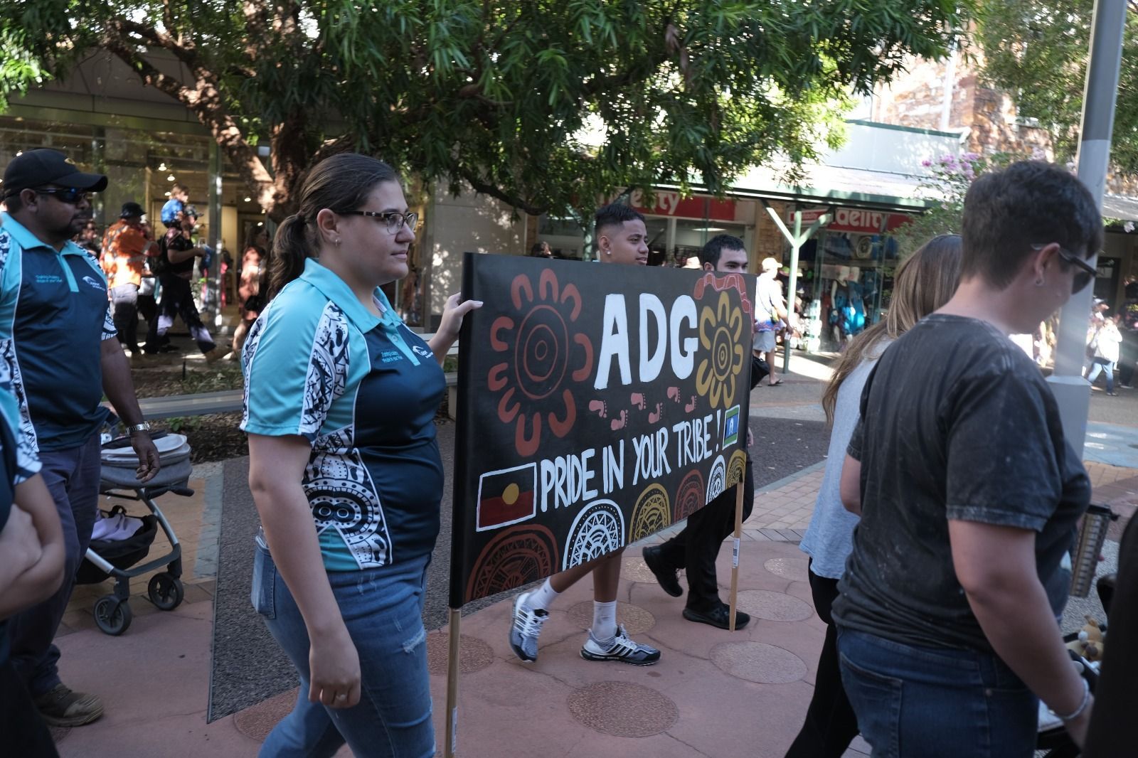 People marching with a sign reading 