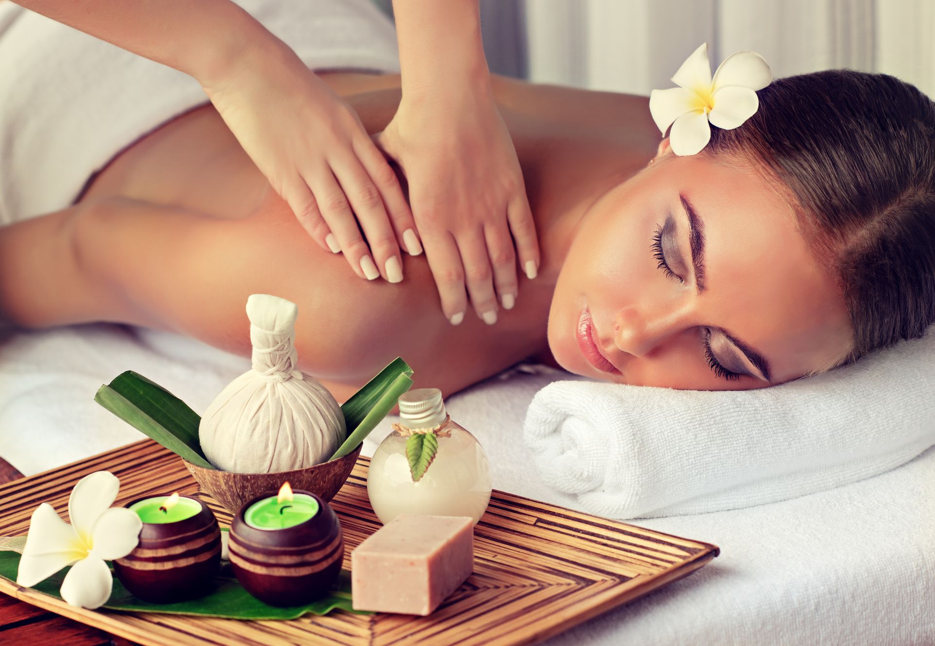 A woman is getting a massage at a spa.