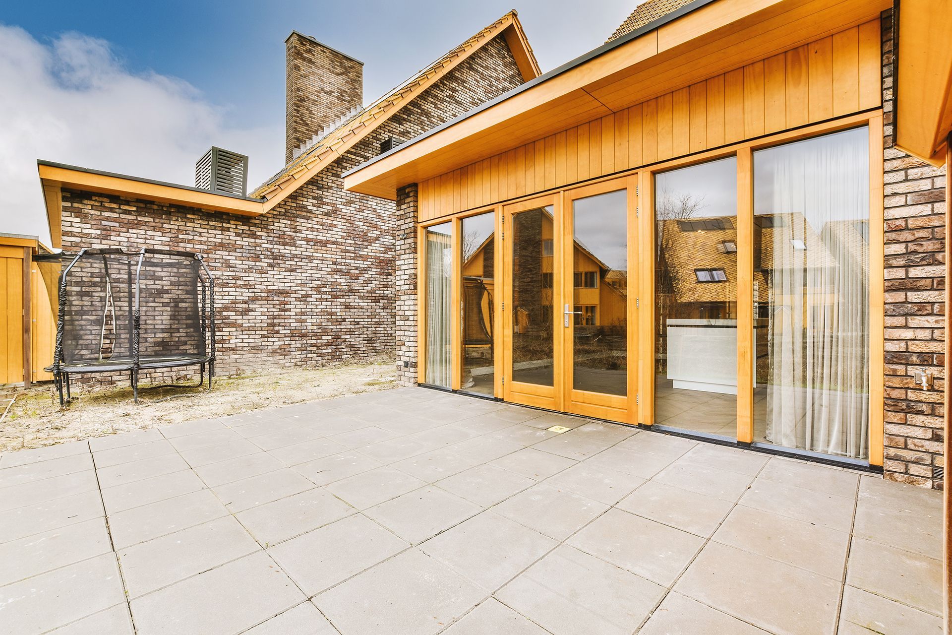 A large house with a lot of windows and doors