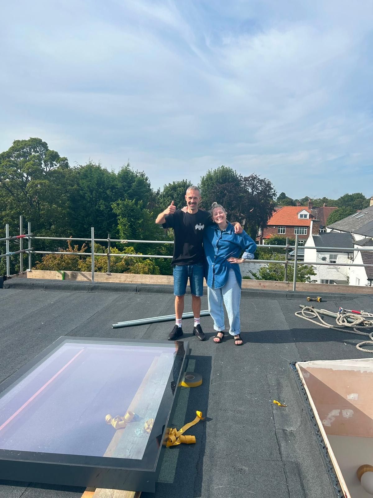 Two happy Central Roofing Contractors customers pictured during a recent roofing project