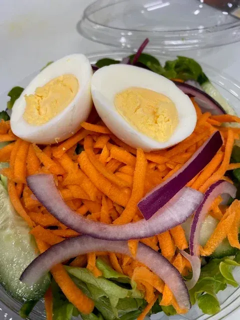 A Salad With Carrots Onions and Hard Boiled Eggs — Cedar Park Fish & Chips In Taranganba, QLD
