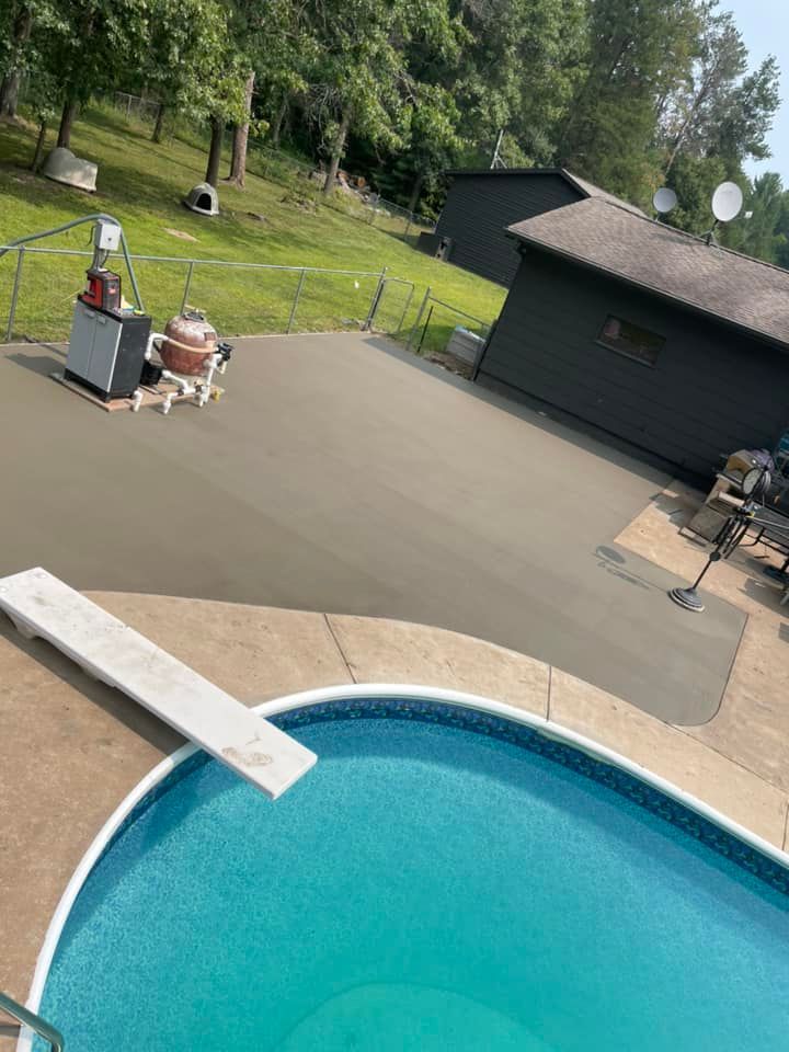 A Large Swimming Pool with A Water Slide in The Background | Altoona, WI | Xtreme Klean