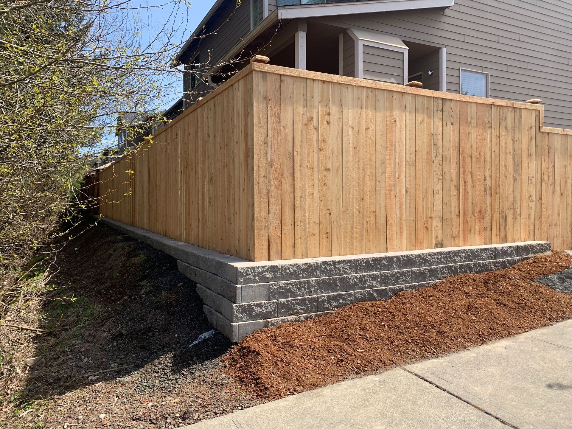 Expertly built fence with retaining wall below in Tumwater, WA