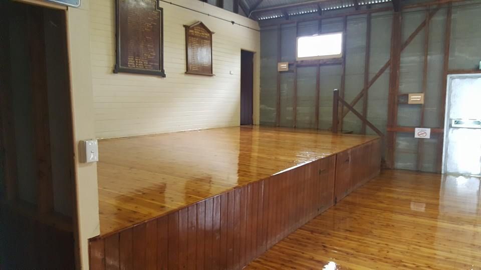 A large empty room with a carpeted floor