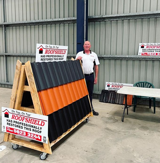 A Man Standing Next to a Roof Shield Sign | Warragul, VIC | Roofshield