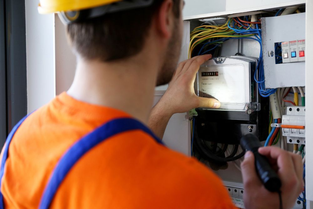 Man Is Looking At A Meter — GSA Group In Garbutt, QLD
