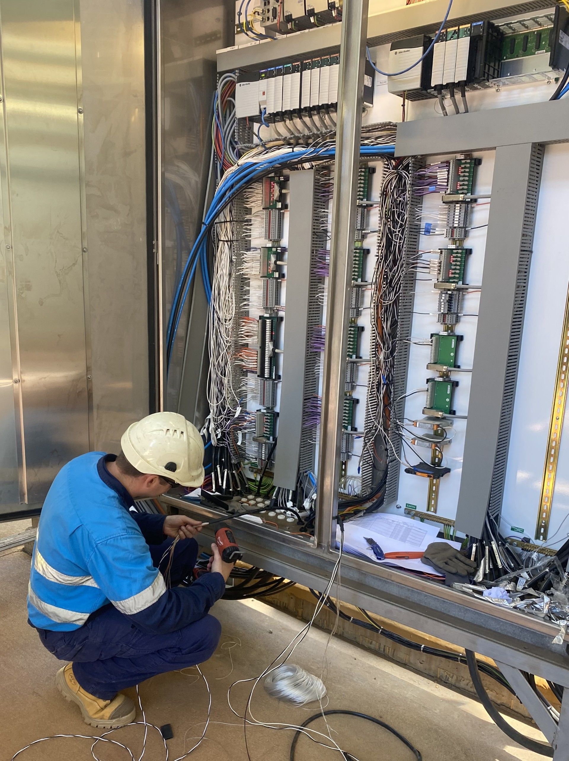 Electrician Inspecting Cable Connection — GSA Group In Garbutt, QLD