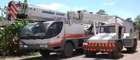 Orange Crane Block and Hook, with Steel Cables Against a Blue Sky — Mareeba Crane Hire In Mareeba, QLD