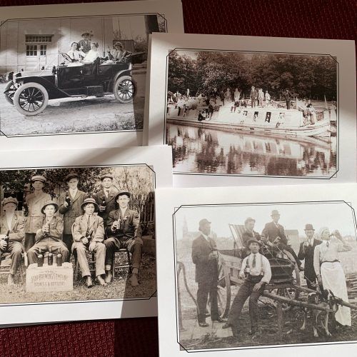 Four sepia vintage photos showing an old car, outdoor scene, seated group, and workers by timber.