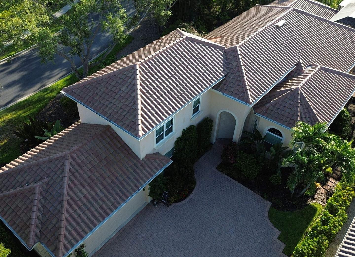 An aerial view of a large house with a tiled roof.