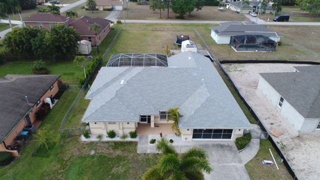 An aerial view of a house in a residential area