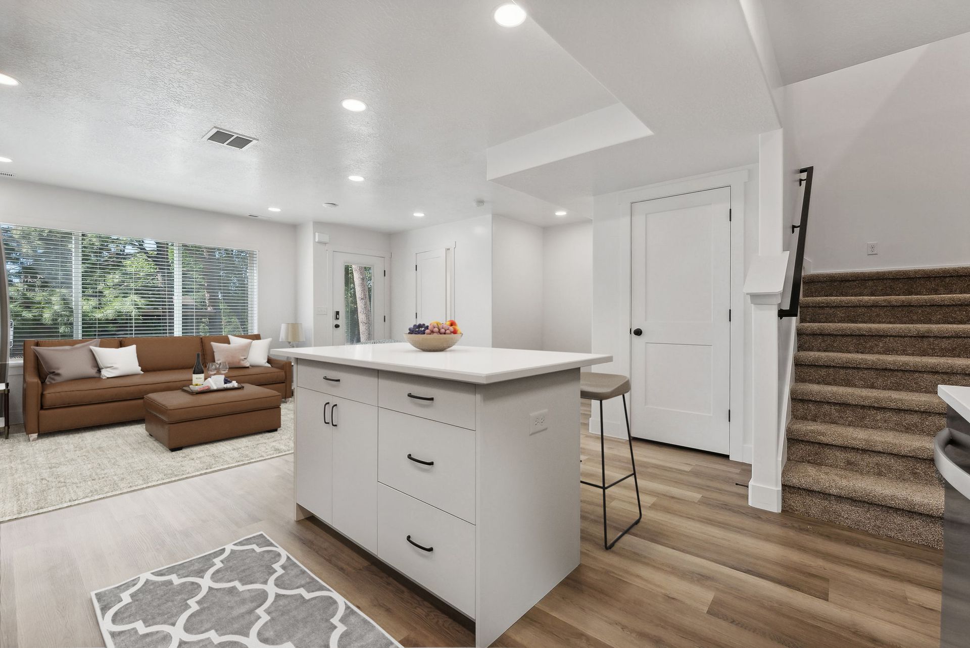 Bright open living room with island Ogden townhome rentals Madison Towns on 40th