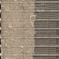 A dusty white wall air vent with a visible buildup of lint and debris, positioned near a floor and baseboard.