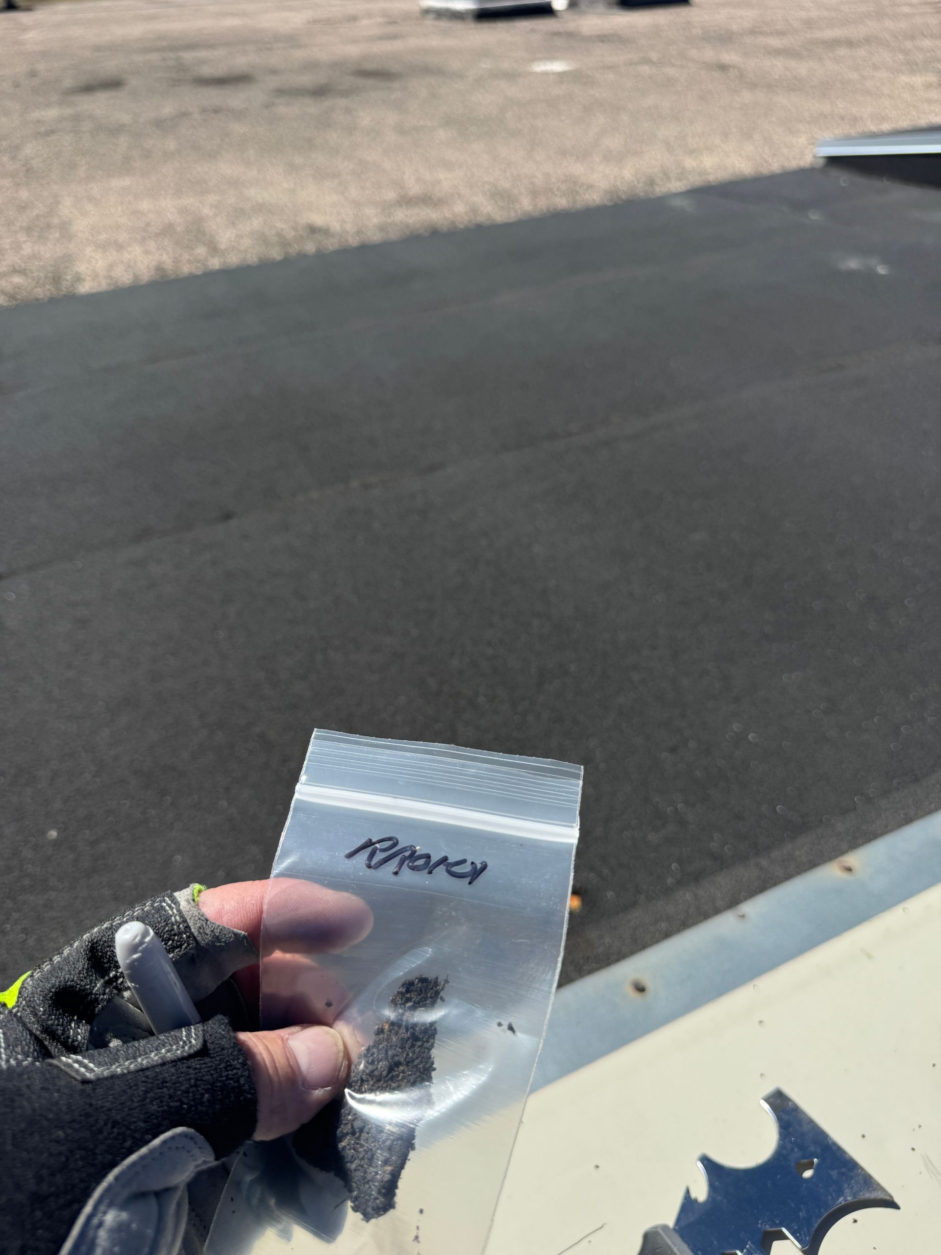 Person holding a bag labeled 