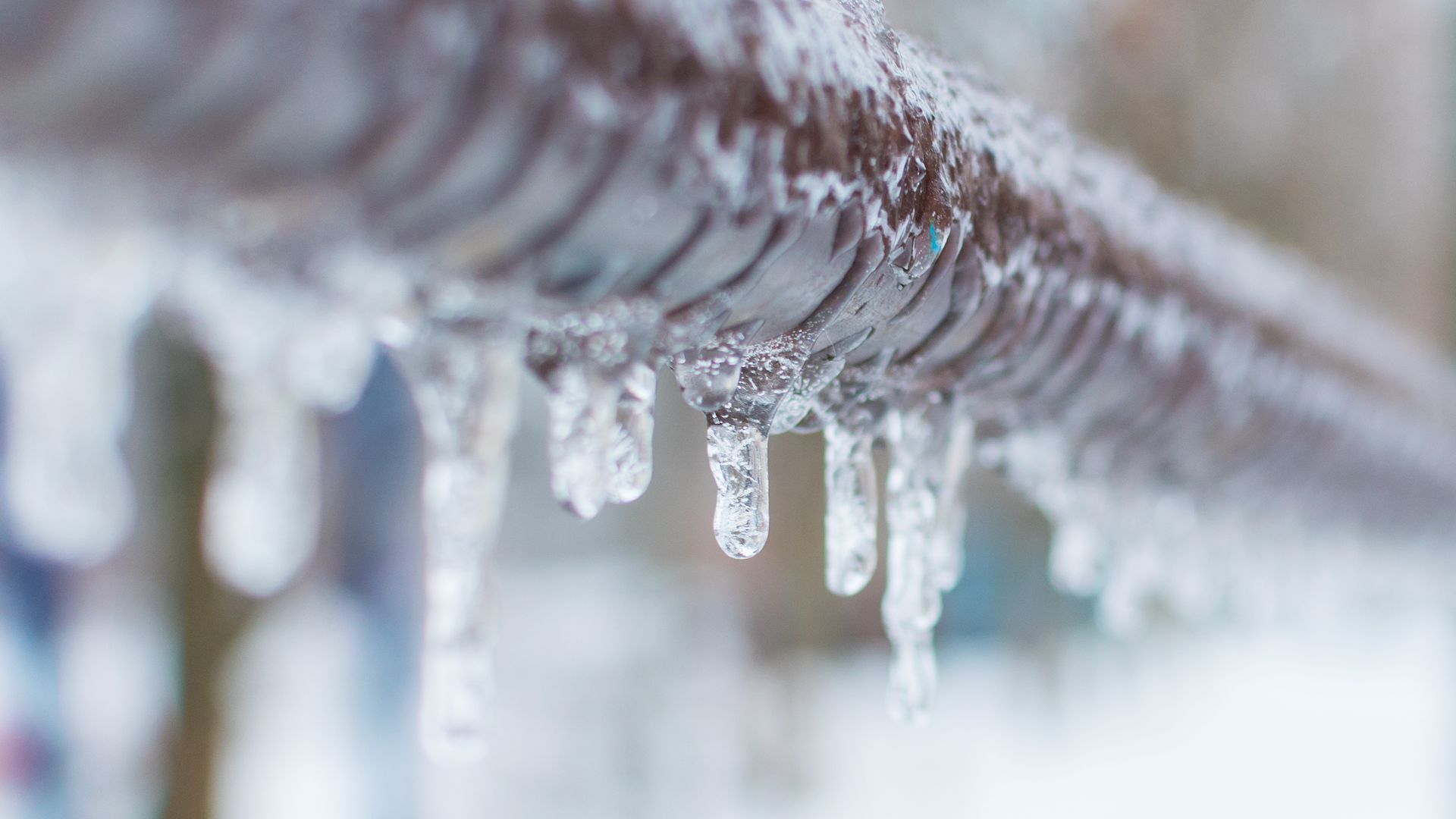 Icicles on a pipe.