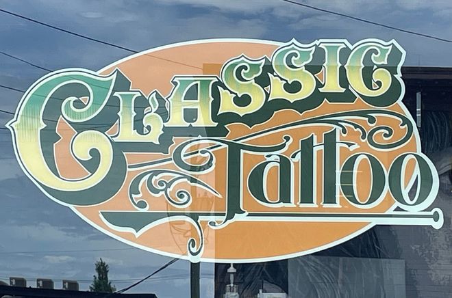 Classic Tattoo logo displayed on the front window of the tattoo shop in Scott's Addition, Richmond, VA.