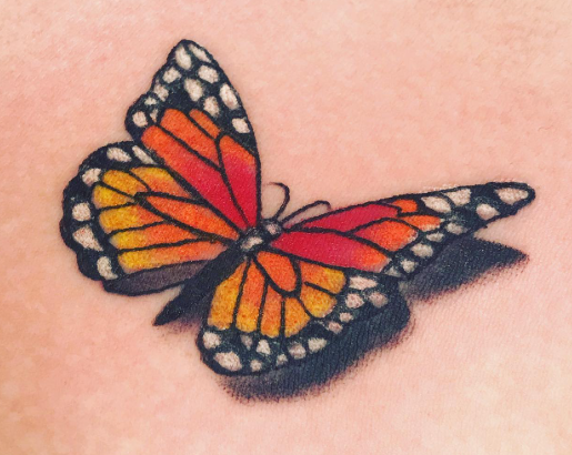 Fine line butterfly tattoo done at Classic Tattoo in Scott's Addition