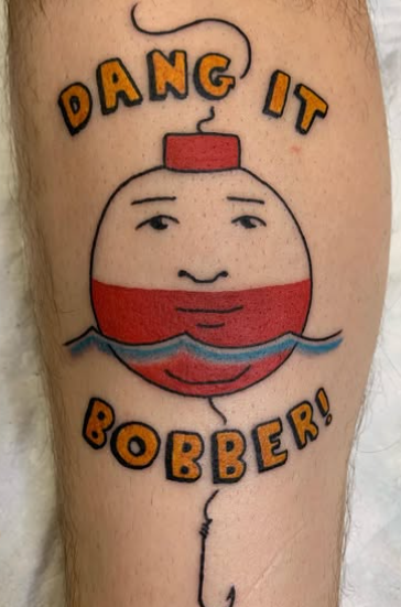 A cartoon bobber tattoo inspired by Bobby from King of the Hill. Completed by Nick Barnett