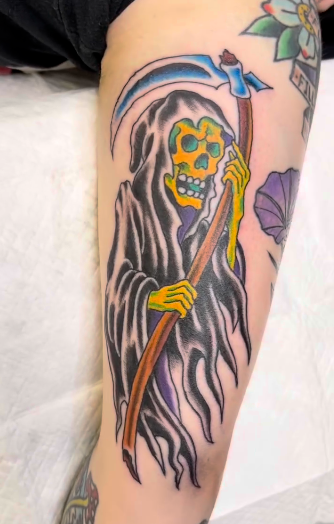 Traditional American reaper tattoo done by Rylee Jennings at Classic Tattoo