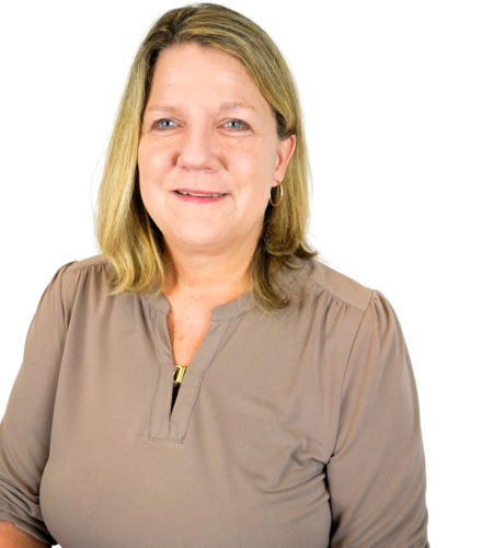 A smiling person with shoulder-length blonde hair, wearing a tan long-sleeved shirt, centered against a white background.