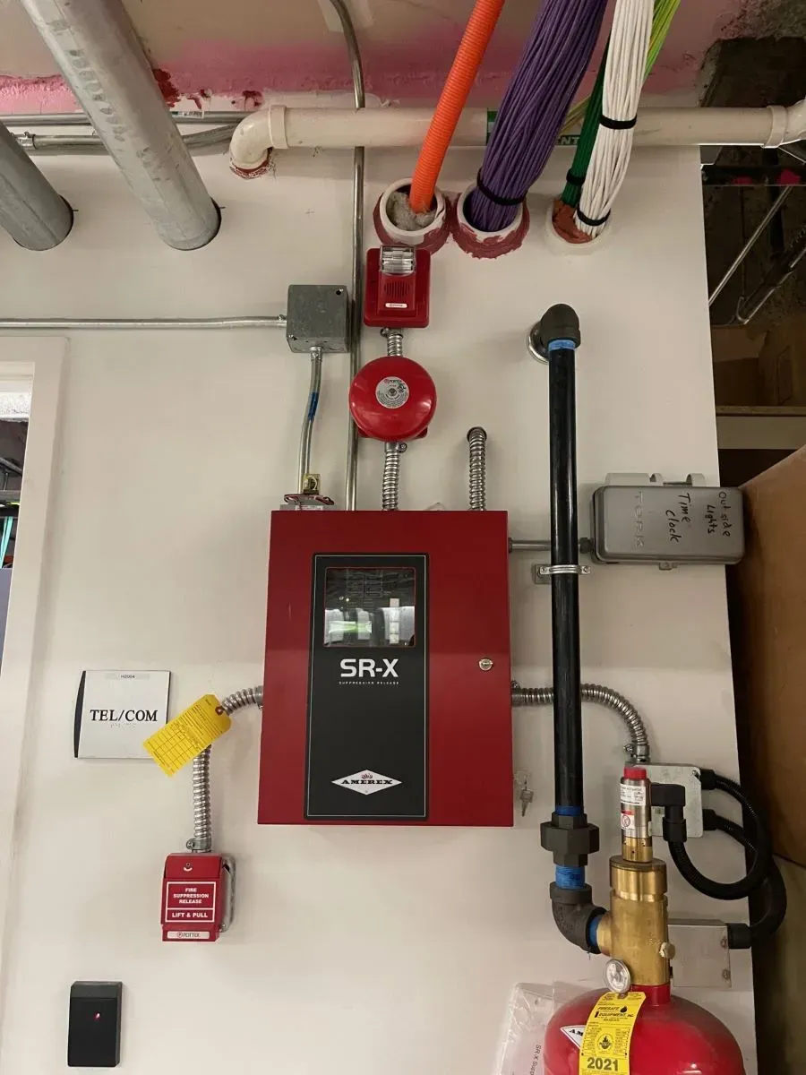 A fire alarm system is installed on the wall of a building.