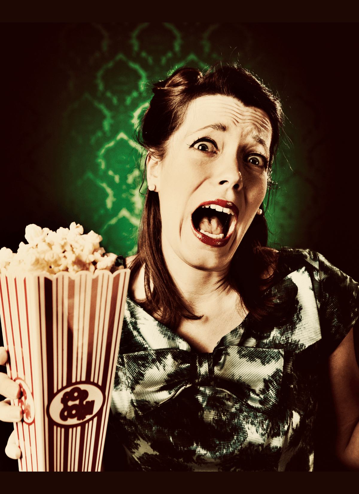 Lady screaming and holding popcorn