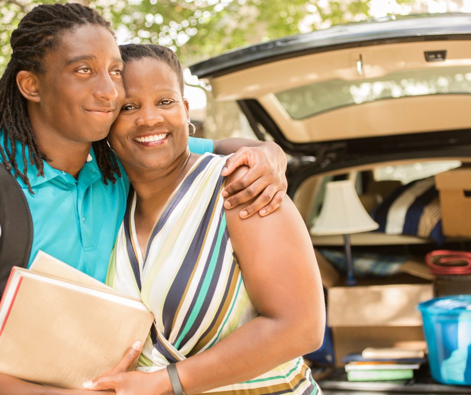 son hugging mom in front of open hatchback car son hugging mom in front of open hatchback car