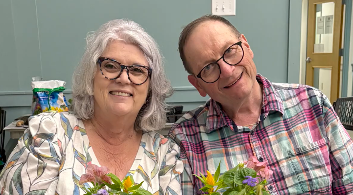 Two smiling Caregiver Volunteers