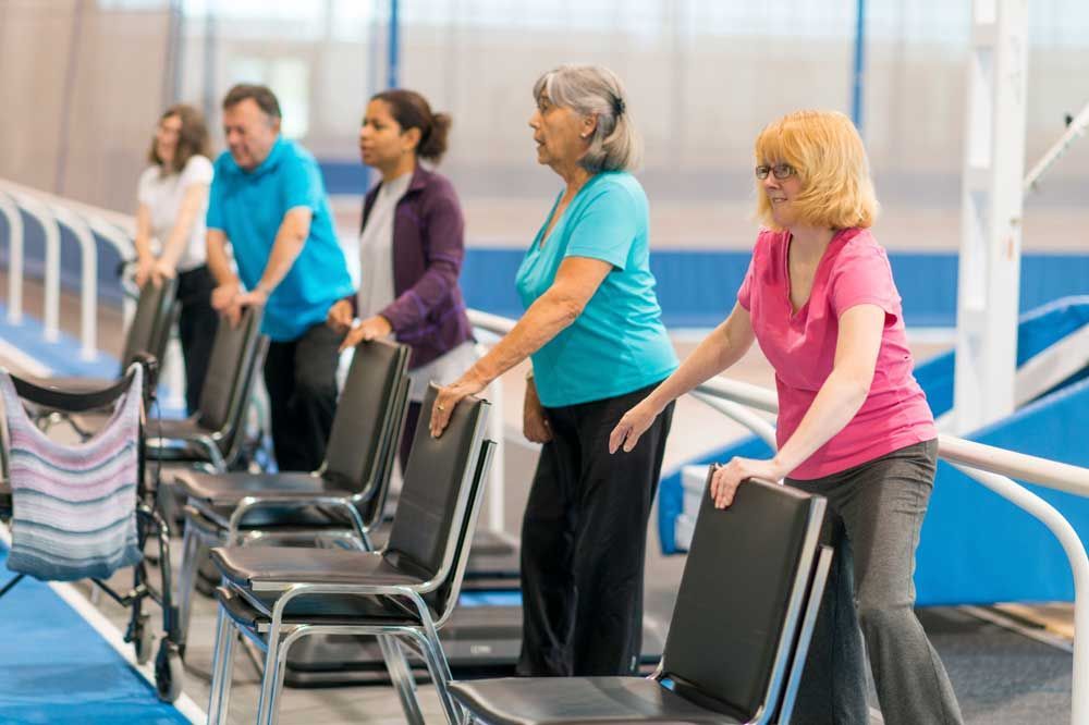 Group of people doin chair exercises