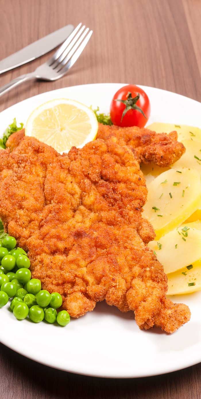 Chicken and peas on a plate