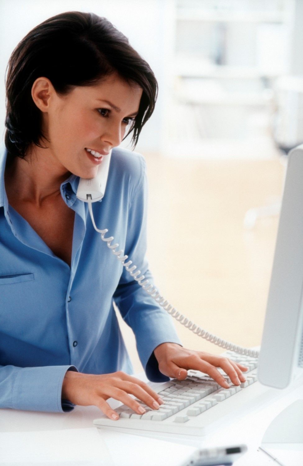 Woman talking on the telephone.