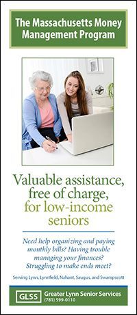A younger woman helping an older woman on a computer.