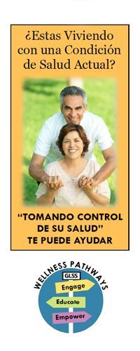 A man and woman outside smiling and holding hands.