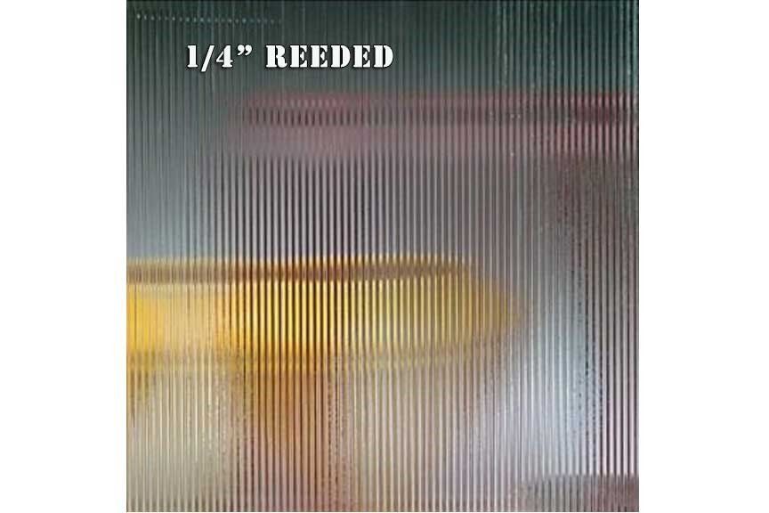 A picture of small reeded glass with a yellow object in the background.