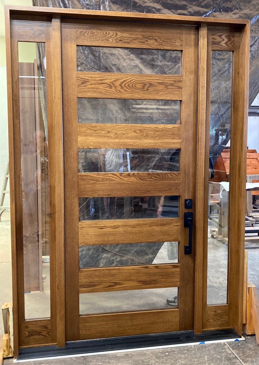 Modern white oak entry door with sidelites