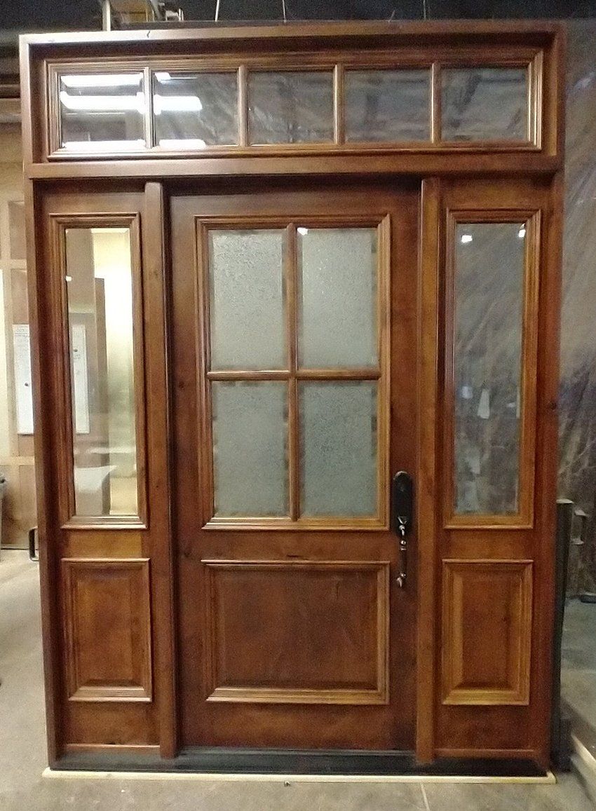 Knotty Alder door with Glue chip beveled glass in door and clear IG in sidelites and transom. Factory finished in Saddle.
