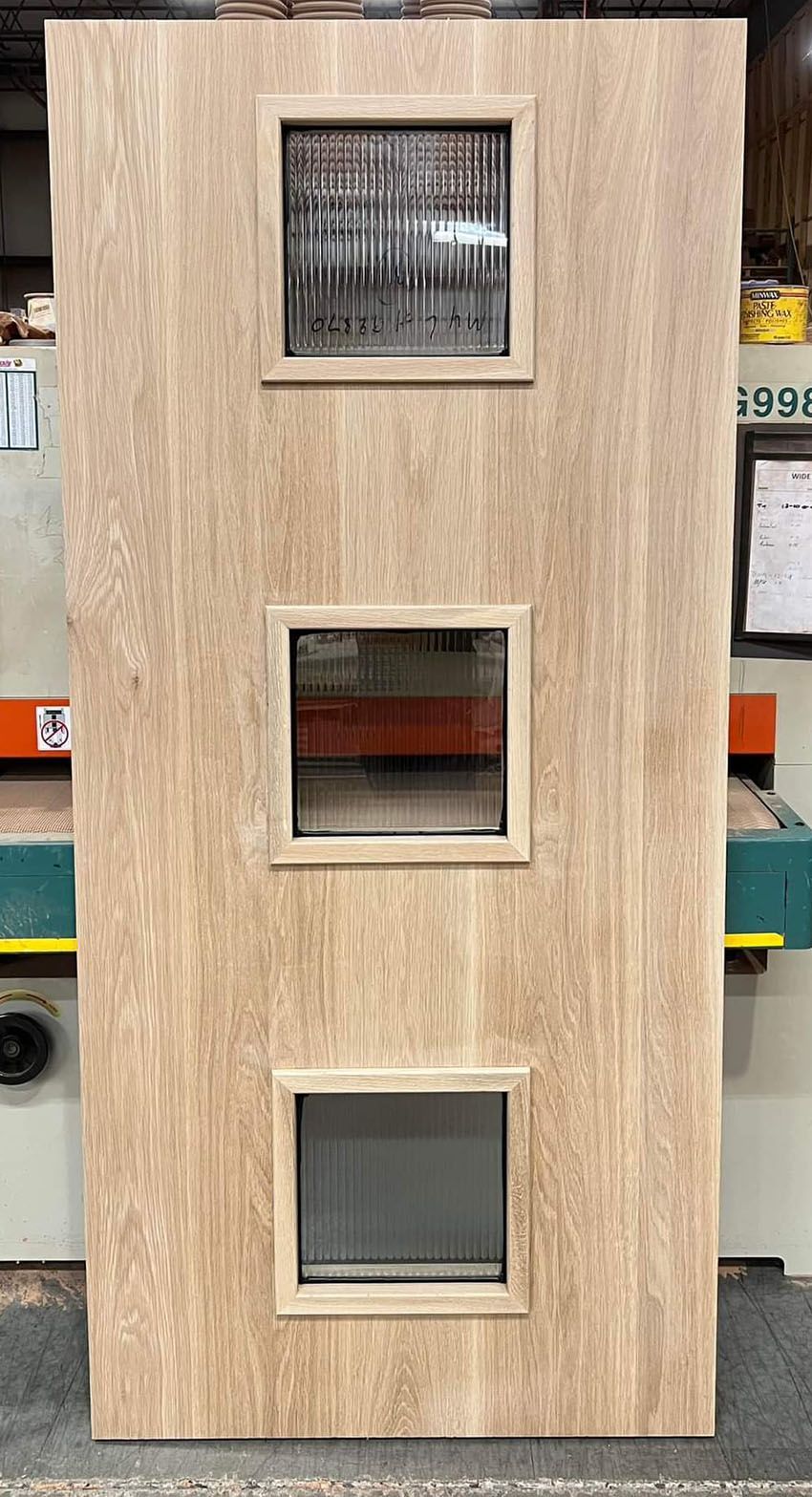 #28326 Vertical Grain Flat Sawn White Oak Flush Door with 3 reeded glass lites.